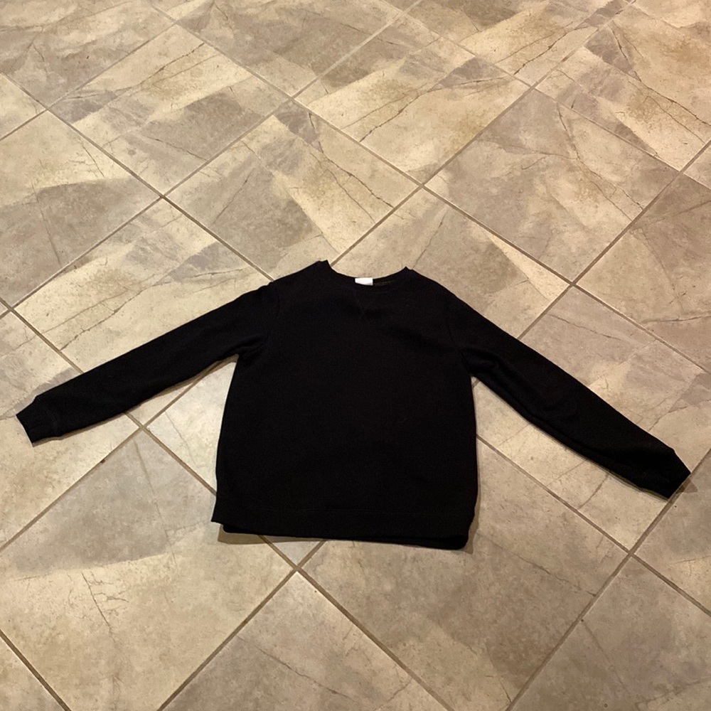 Black crew neck with with gold lining at neck area